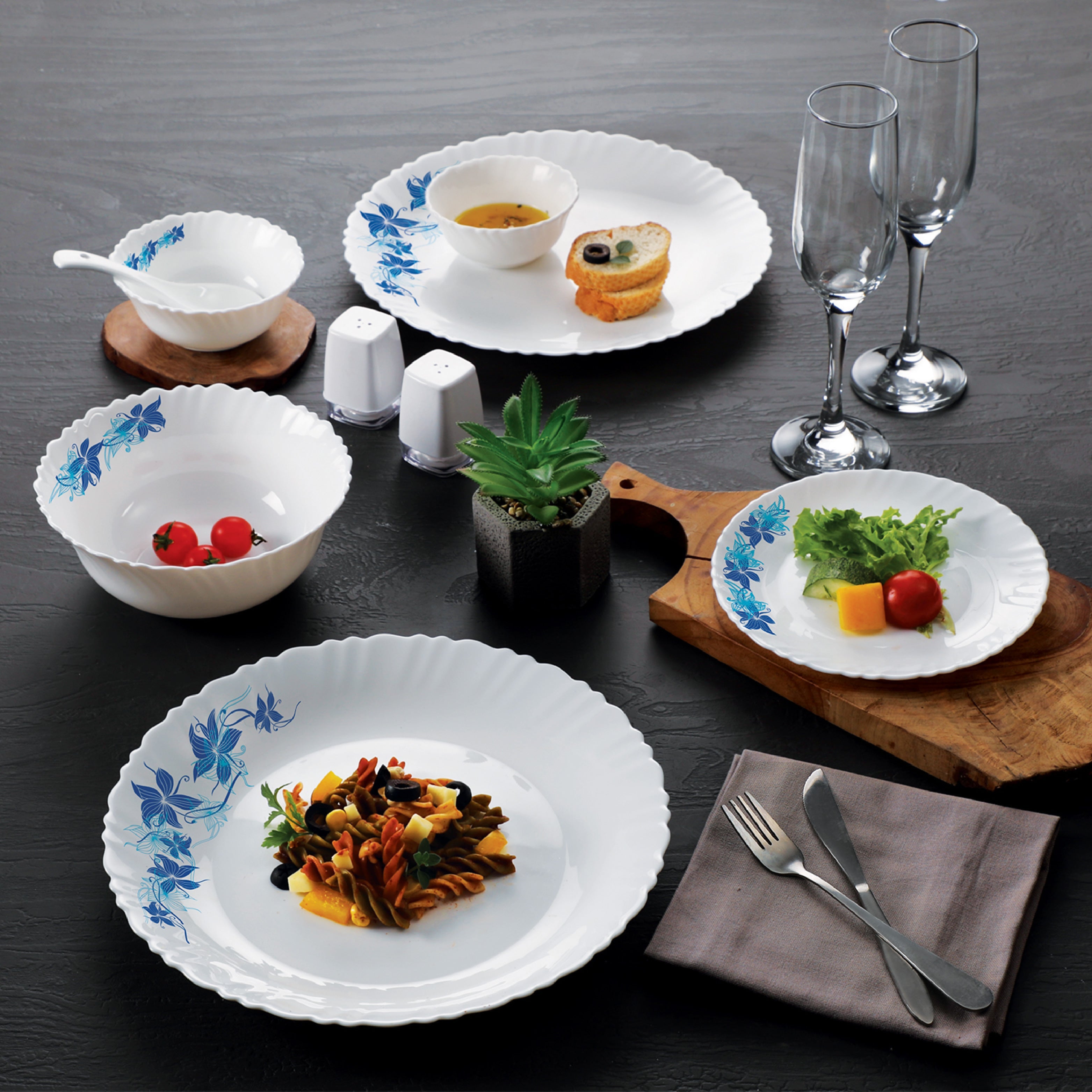 Vibrant 49-piece opalware dinner set, adorned with floral motifs. Includes plates, bowls, and serveware for elegant dining